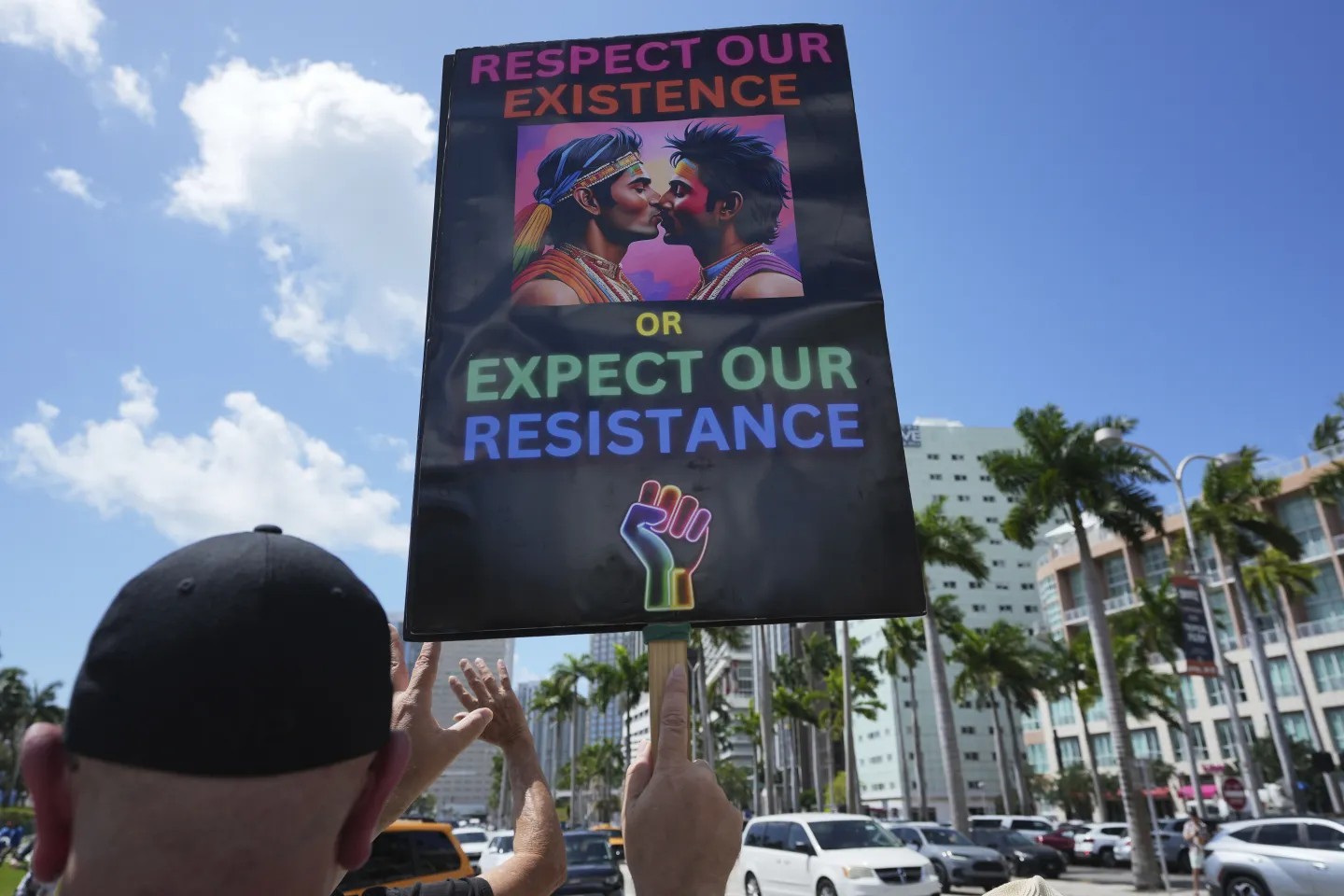 A person holds a sign in support of gay rights during a protest against the Trump administration, Saturday, April 19, 2025, in Miami. (AP Photo/Lynne Sladky) A person holds a sign in support of gay rights during a protest against the Trump administration, Saturday, April 19, 2025, in Miami. (AP Photo/Lynne Sladky)