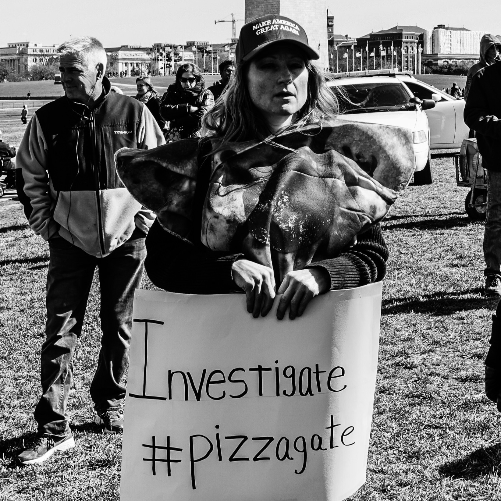 A female attending a Pizzagate rally in the Washington, D.C. area, 2017. Picture by Ted Eytan @ www.flickr.com/photos/taedc/33124312291/in/photostream/