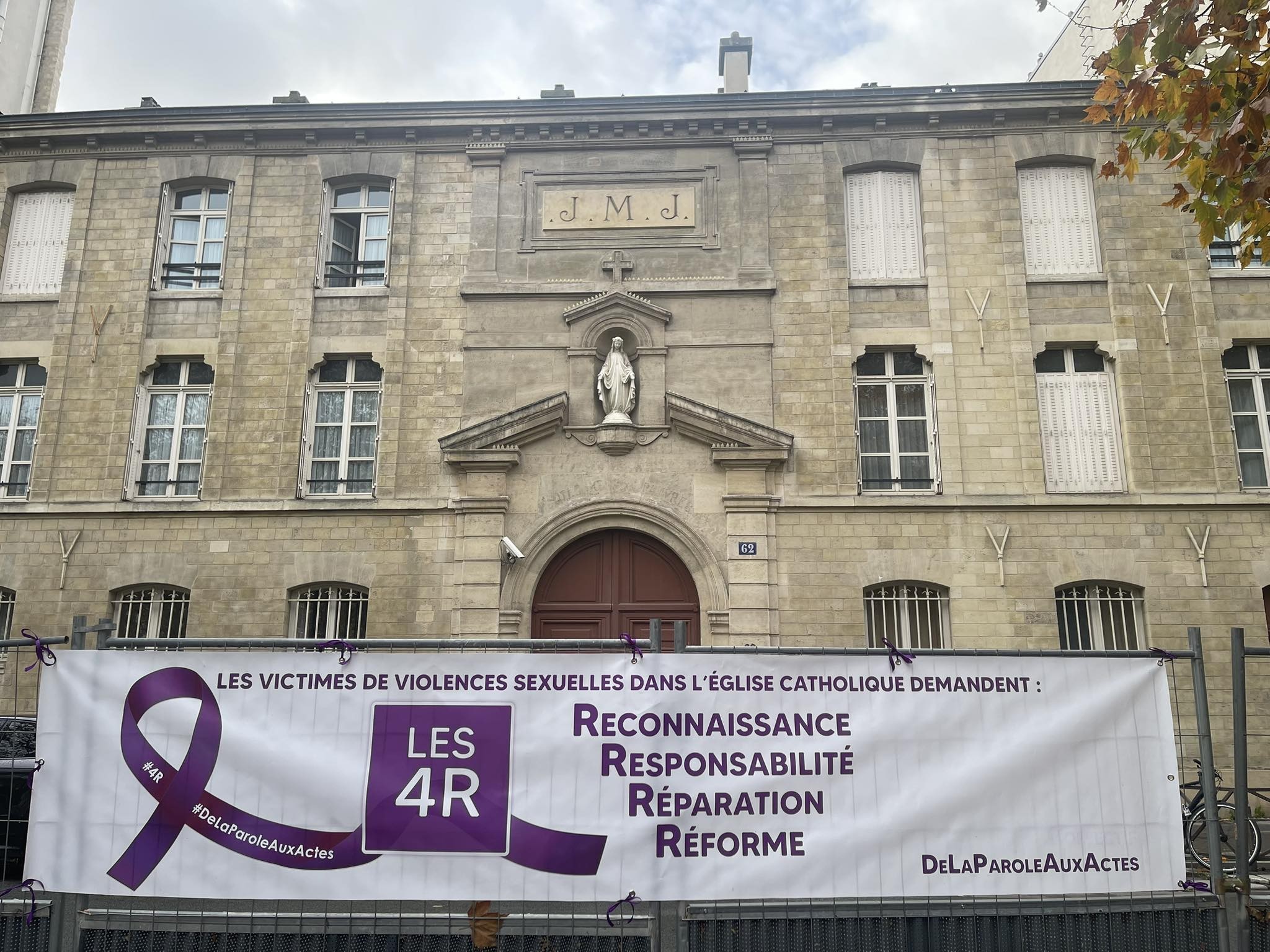 One of the banners placed during the rally at the headquarters of the Conference of Catholic Bishops in Paris, France. The 