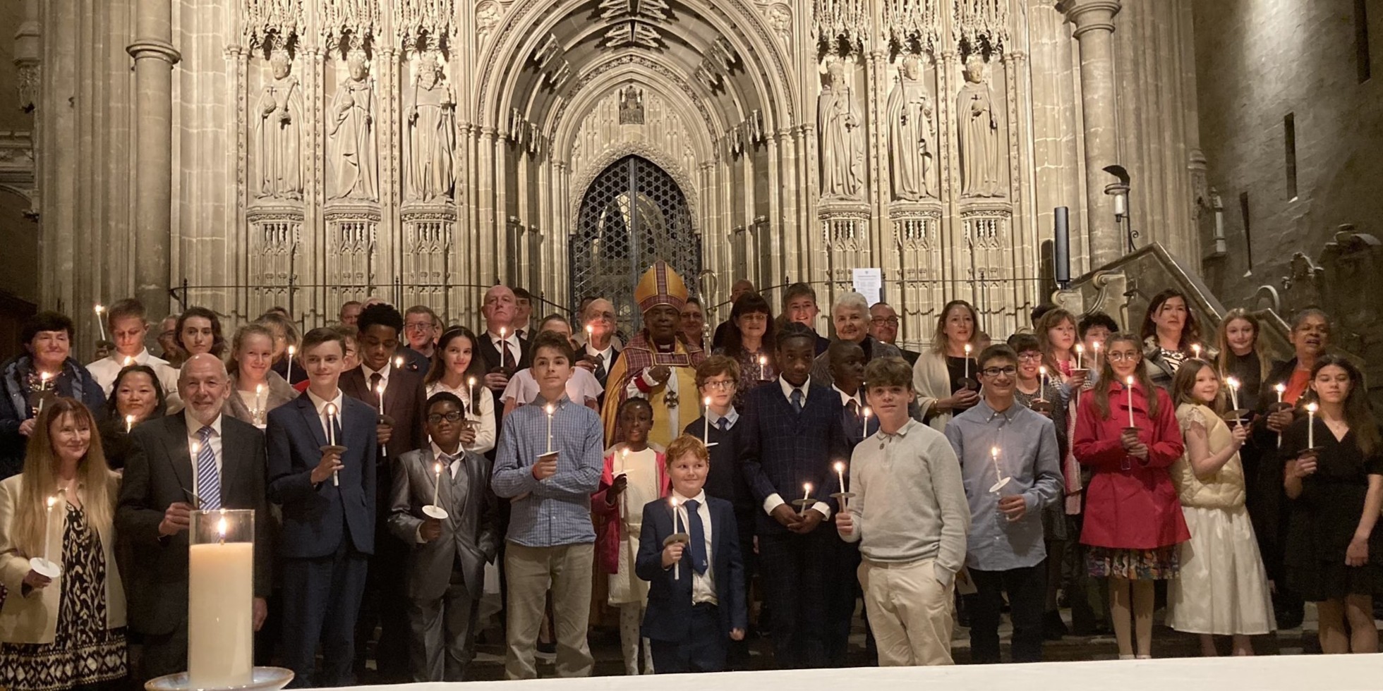 Bishop Rose Hudson-Wilkin (at center) confirms a group of young Anglican faithful in their faith at Canterbury Cathedral, United Kingdom, November 25, 2023. From the Cathedral's Facebook account. 