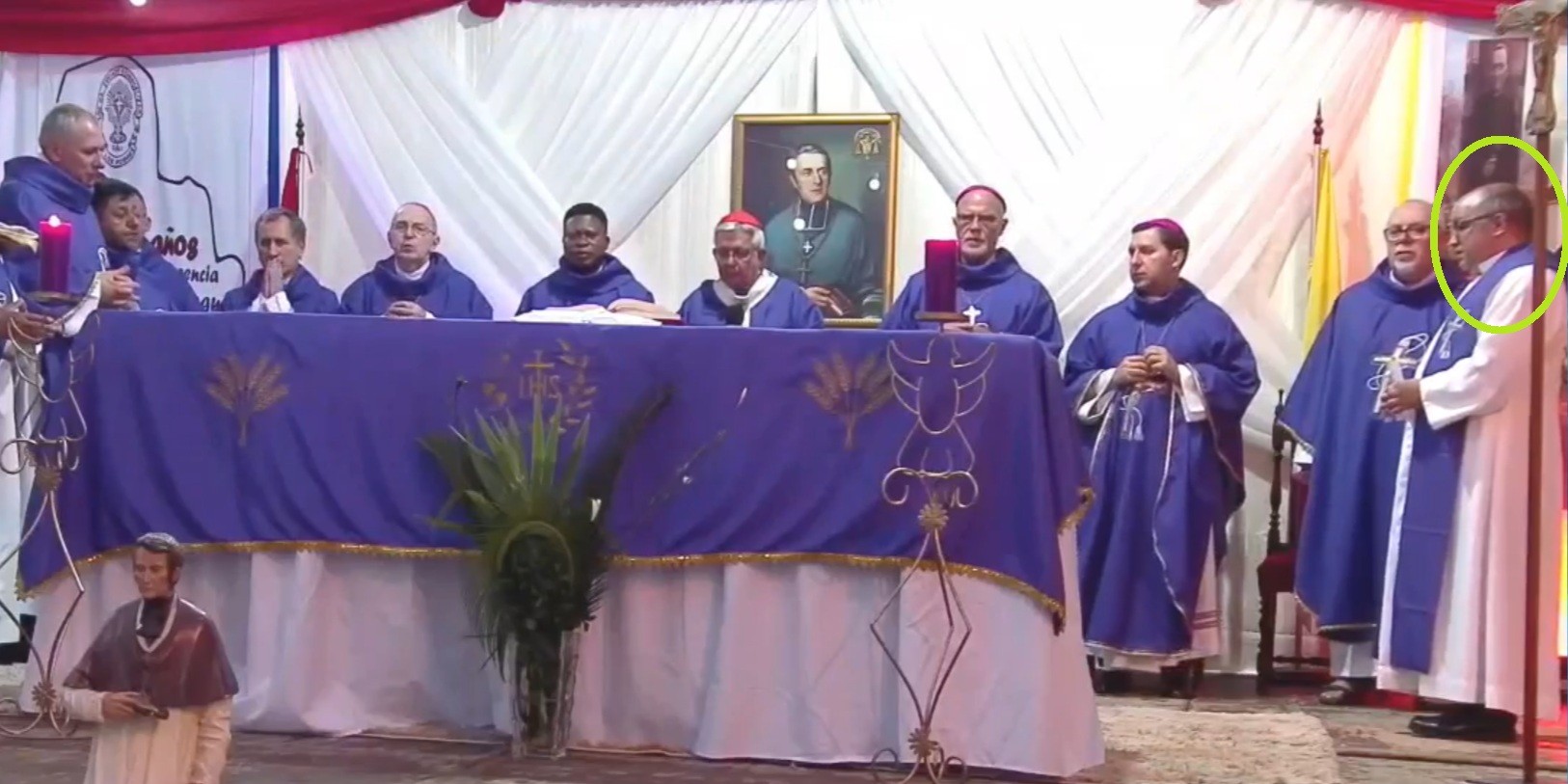 At center, wearing a scarlet zucchetto and pallium, Cardinal Adalberto Martínez Flores, archbishop of Asunción, surrounded by other leading clerics. To the far right, circled in green, is Rafael López Fleitas, the Oblate priest accused of abuse that this series has been tracking, December 13, 2025. Parish of San Blas de Loma Pyta/Social Media. 