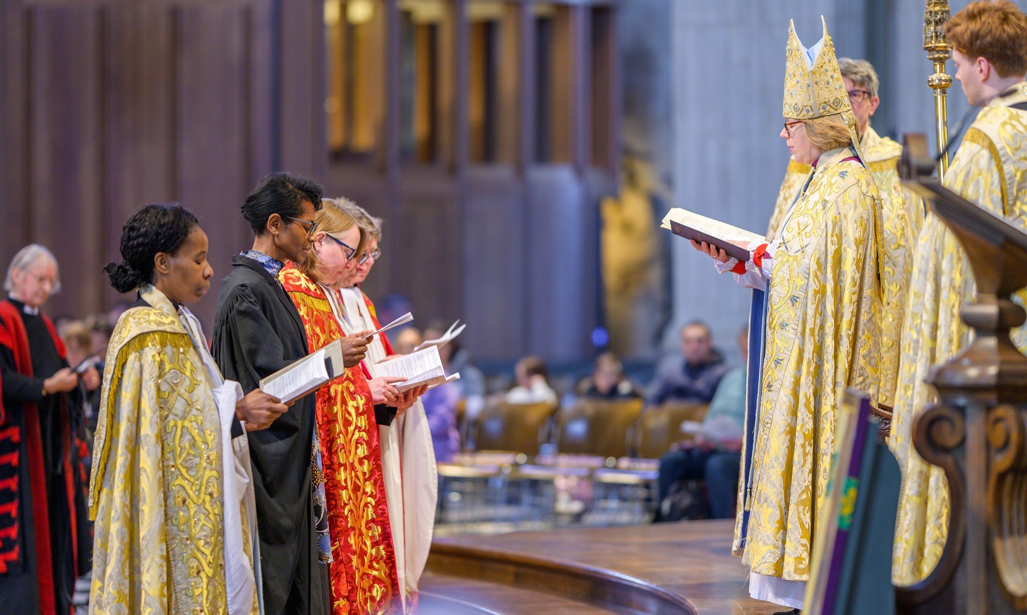 Wearing a mitre and holding a book, Sarah Mullally, archbishop-designate of Canterbury presides a ceremony to appoint a group of Anglican clergy at Saint Paul's Cathedral in London, February 4 2025. From the Cathedral's profile at Facebook. 