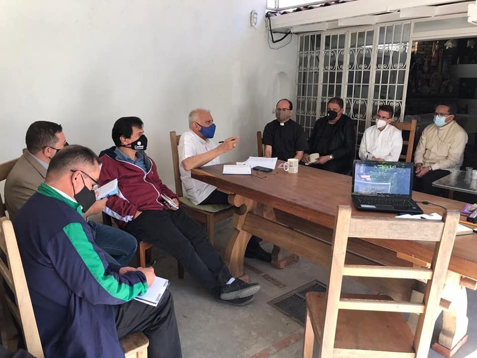 Wearing a blue facemask and a white shirt, Cardinal Baltazar Enrique Porras Cardozo presides over a meeting of the pastoral teams at the archdiocese of Mérida, January 5, 2021. At the time, he was in charge of both dioceses. Social media of the archdiocese of Caracas, Venezuela.
