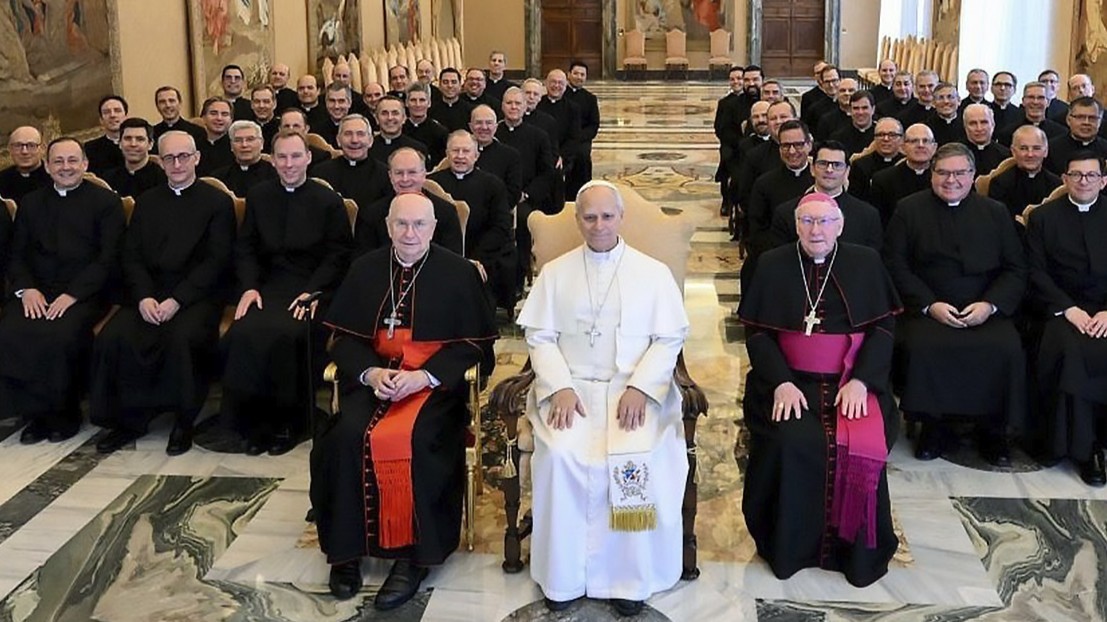At center, Leo XIV flanked by Cardinal Fernando Vérgez Alzaga (left) and bishop Brian Farrell, both members of the Legion of Christ, February 19, 2026. Social media of the Legion of Christ. 