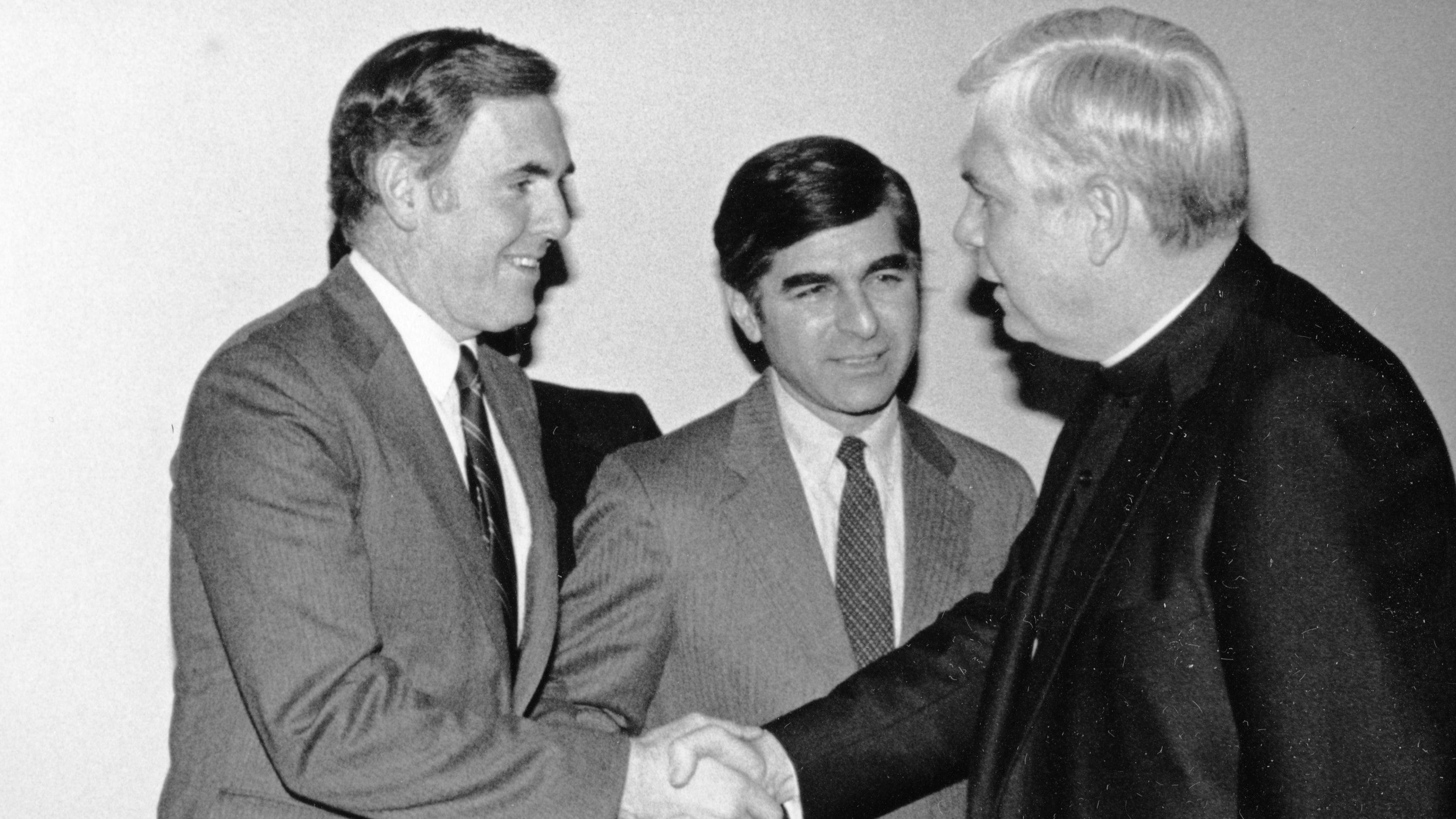 Mayor Raymond L. Flynn (left), governor Michael S. Dukakis of Massachusetts, and then-archbishop and cardinal Bernard Law in a mid-1980s picture. Mayor Raymond L. Flynn records, Collection #0246.001. File name: RF_0608, @ www.flickr.com/photos/48039697@N05/9617962460 