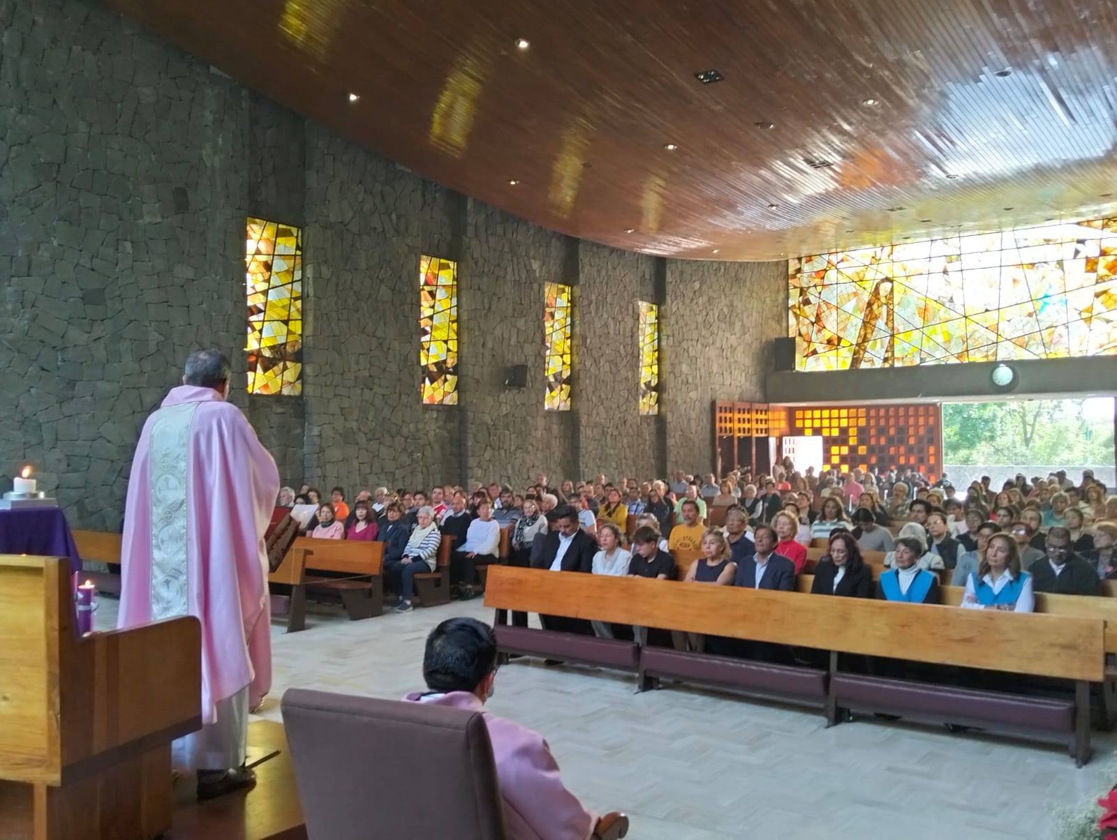 A view from the presbyterium of the magnificence of the main nave of Mary Queen parish, combining the volcanic rock walls, the wooden cieling and the huge vitral over the entrance, during the third Sunday of Advent 2025. From their social media. A view from the presbyterium of the magnificence of the main nave of Mary Queen parish, combining the volcanic rock walls, the wooden cieling and the huge vitral over the entrance, during the third Sunday of Advent 2025. From their social media.