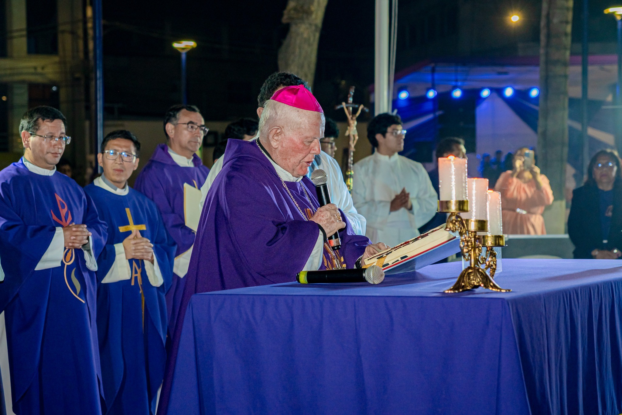 Holding a microphone, Antonio Santarsiero Rosa, bishop of Huacho, Peru, while presiding at a Mass in a public park in his diocese, October 29, 2025. From his diocese's social media. 