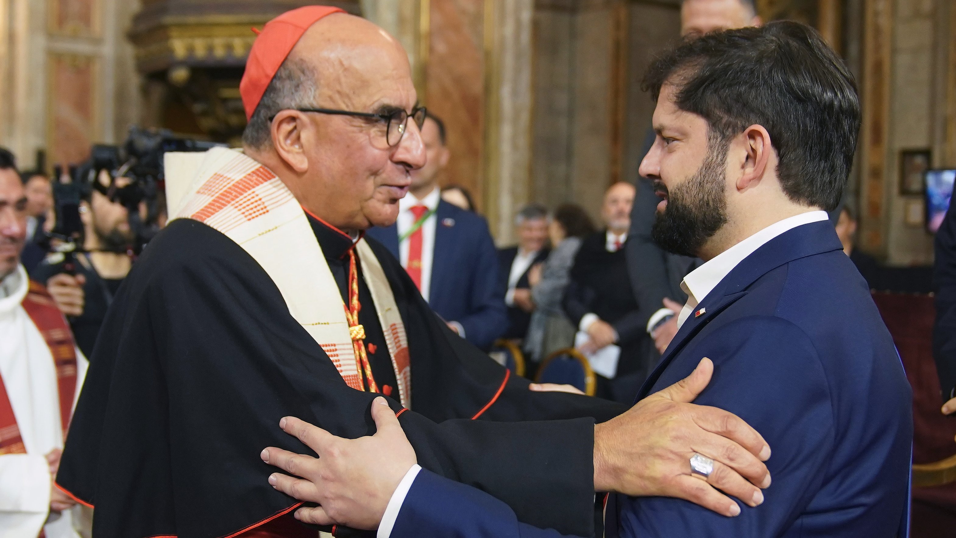 Cardinal Fernando Chomalí Garib, archbishop of Santiago de Chile, greets then President Gabriel Boric before the Ecumenical Te Deum at the Cathedral, September 18, 2025. Picture of the Chilean Presidency. Cardinal Fernando Chomalí Garib, archbishop of Santiago de Chile, greets then President Gabriel Boric before the Ecumenical Te Deum at the Cathedral, September 18, 2025. Picture of the Chilean Presidency.